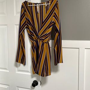 Slightly worn romper. Peppermint brand size large.